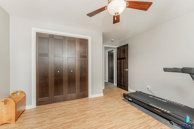 1302 Ripple Creek Rd, Dell Rapids, SD 57022 - exercise area with a ceiling fan, light wood-style flooring, and baseboards