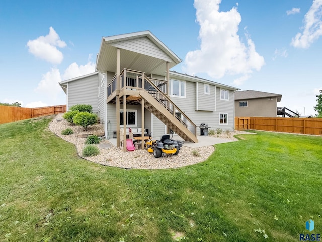 1302 Ripple Creek Rd, Dell Rapids, SD 57022 - rear view of house featuring stairway, a deck, and a patio area