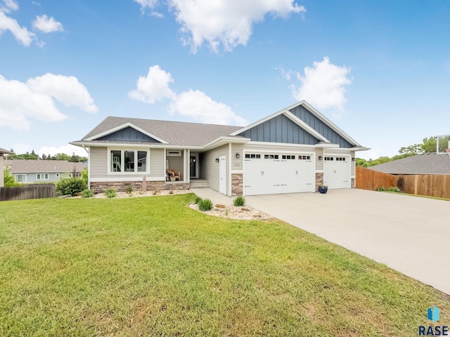 1302 Ripple Creek Rd, Dell Rapids, SD 57022 - craftsman-style house with board and batten siding, stone siding, an attached garage, driveway, and roof with shingles