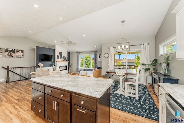 1302 Ripple Creek Rd, Dell Rapids, SD 57022 - kitchen featuring stainless steel dishwasher, light wood-style floors, ceiling fan, a chandelier, and open floor plan