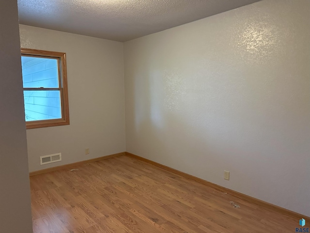 800 N Poplar St, Bridgewater, SD 57319 - empty room featuring light wood-type flooring and baseboards