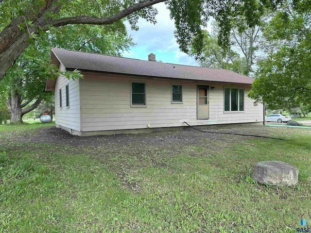 800 N Poplar St, Bridgewater, SD 57319 - rear view of property featuring a chimney