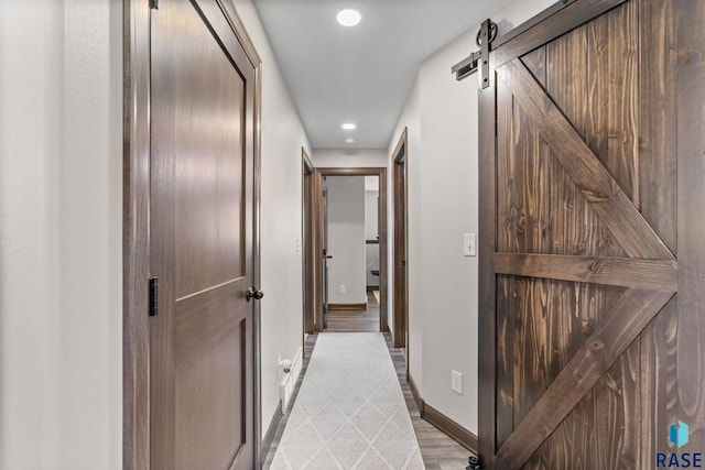 7305 W Jacob Cir, Sioux Falls, SD 57106 - hallway featuring recessed lighting, baseboards, and a barn door