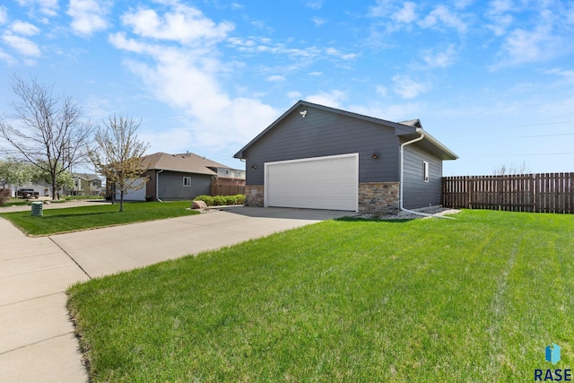 7305 W Jacob Cir, Sioux Falls, SD 57106 - view of property exterior featuring concrete driveway and stone siding