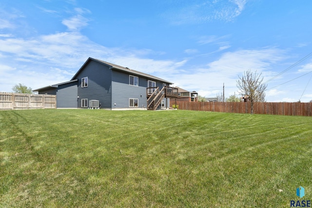 7305 W Jacob Cir, Sioux Falls, SD 57106 - back of property with stairs, a wooden deck, and central air condition unit