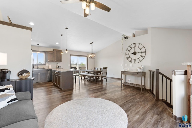 7305 W Jacob Cir, Sioux Falls, SD 57106 - living room with dark wood-type flooring, a ceiling fan, vaulted ceiling, baseboards, and recessed lighting