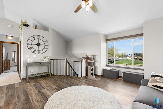 7305 W Jacob Cir, Sioux Falls, SD 57106 - living area featuring wood finished floors, lofted ceiling, ceiling fan, and baseboards