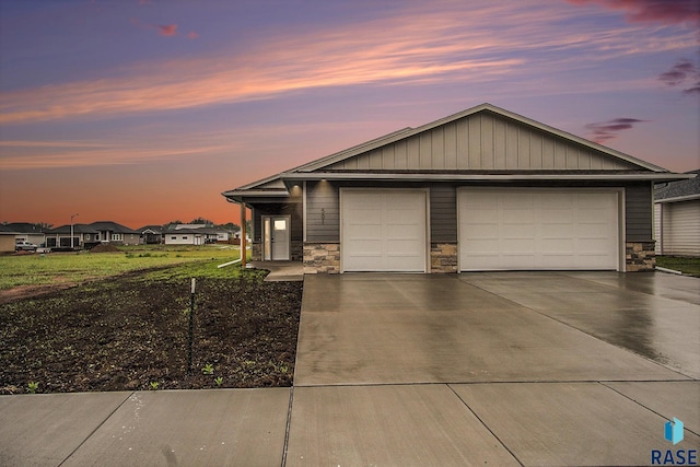 501 S Huckleberry Trl, Harrisburg, SD 57032 - view of front of home featuring stone siding and driveway