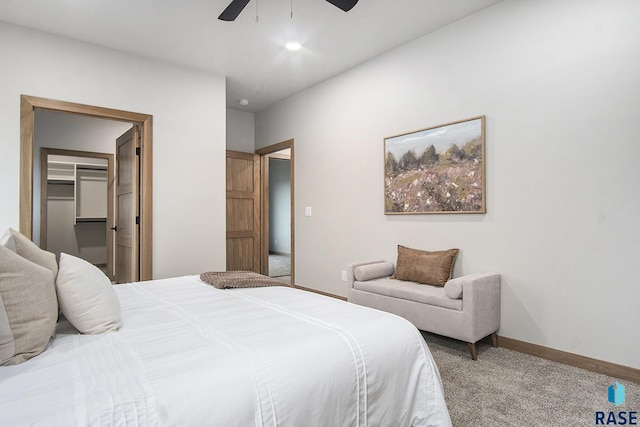 501 S Huckleberry Trl, Harrisburg, SD 57032 - carpeted bedroom featuring ceiling fan, a spacious closet, and baseboards