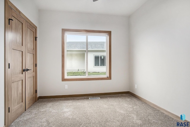 501 S Huckleberry Trl, Harrisburg, SD 57032 - unfurnished bedroom featuring light carpet and baseboards