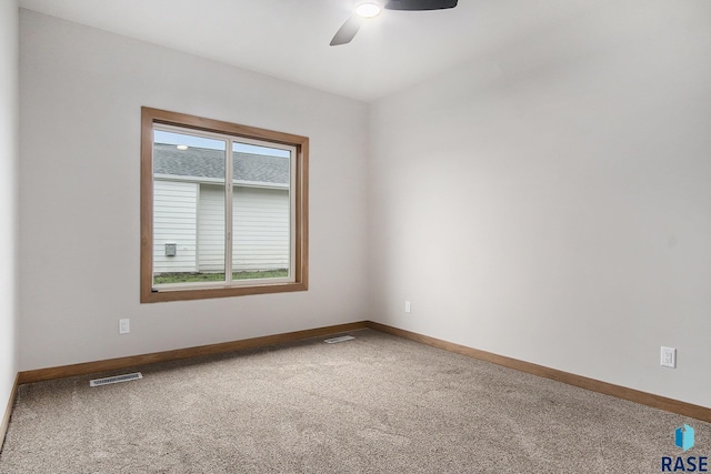 501 S Huckleberry Trl, Harrisburg, SD 57032 - unfurnished room with carpet flooring, baseboards, and a ceiling fan