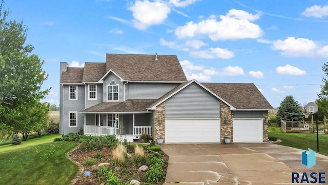 27055 Saddlerock Pl, Harrisburg, SD 57032 - traditional-style home featuring covered porch, a front yard, an attached garage, roof with shingles, and concrete driveway