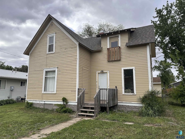 816 W 4th St, Canton, SD 57013 - back of property with a yard and roof with shingles