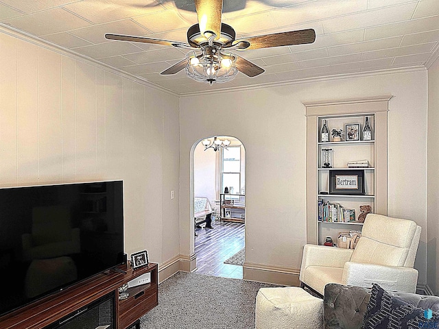 816 W 4th St, Canton, SD 57013 - sitting room with crown molding, ceiling fan, built in features, and arched walkways