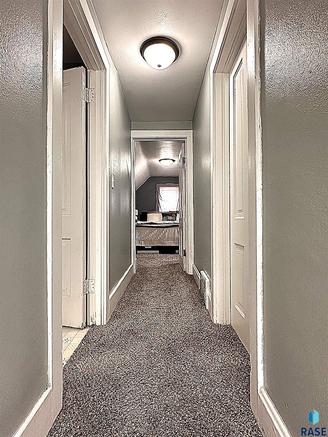 816 W 4th St, Canton, SD 57013 - corridor featuring carpet flooring, baseboards, and a textured ceiling