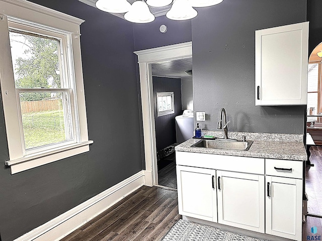 816 W 4th St, Canton, SD 57013 - kitchen with a sink, dark wood finished floors, white cabinets, and light stone countertops