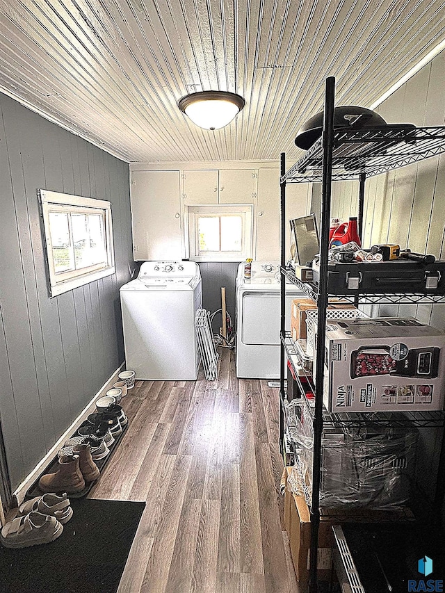 816 W 4th St, Canton, SD 57013 - laundry room with washer and clothes dryer, wooden ceiling, wood finished floors, and wood walls