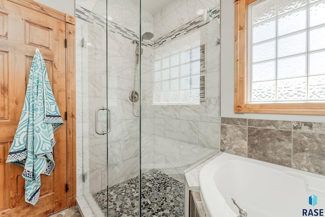 1817 W Ashton Trl, Brandon, SD 57005 - bathroom featuring a bath and a stall shower