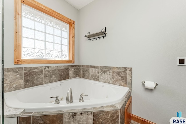 1817 W Ashton Trl, Brandon, SD 57005 - bathroom featuring a jetted tub and baseboards