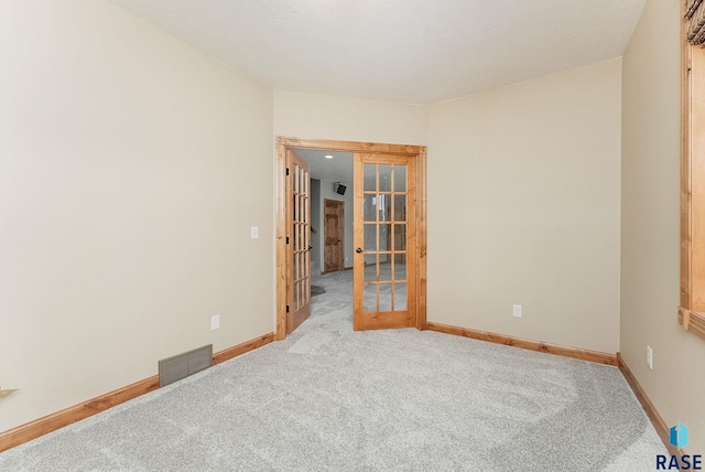1817 W Ashton Trl, Brandon, SD 57005 - spare room featuring french doors, carpet floors, and baseboards