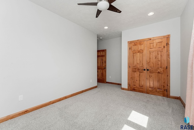 1817 W Ashton Trl, Brandon, SD 57005 - unfurnished bedroom featuring carpet floors, baseboards, ceiling fan, recessed lighting, and a textured ceiling