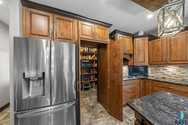 1301 S Hyannis Port Ln, Sioux Falls, SD 57106 - kitchen with stainless steel fridge with ice dispenser, backsplash, dark stone counters, brown cabinetry, and recessed lighting