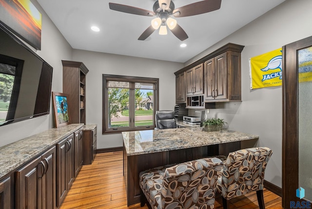 1301 S Hyannis Port Ln, Sioux Falls, SD 57106 - kitchen featuring light wood-style flooring, a peninsula, dark brown cabinetry, baseboards, and recessed lighting