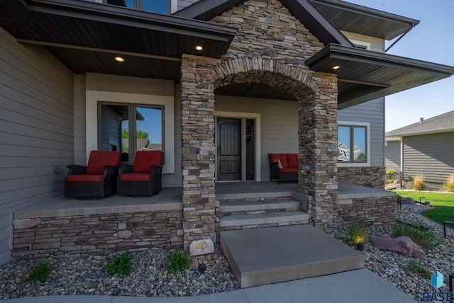 1301 S Hyannis Port Ln, Sioux Falls, SD 57106 - entrance to property with stone siding and a porch