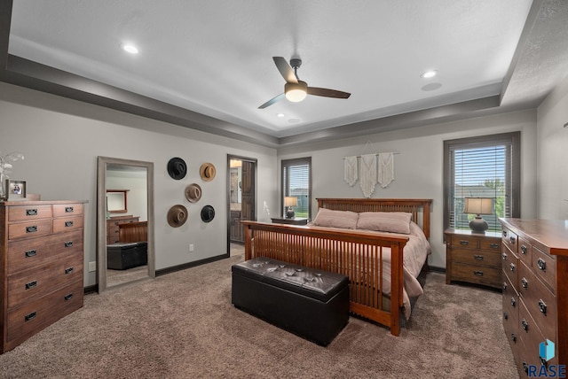 1301 S Hyannis Port Ln, Sioux Falls, SD 57106 - bedroom featuring a tray ceiling, carpet, baseboards, ensuite bath, and recessed lighting