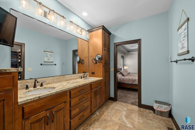 1301 S Hyannis Port Ln, Sioux Falls, SD 57106 - ensuite bathroom featuring double vanity and baseboards