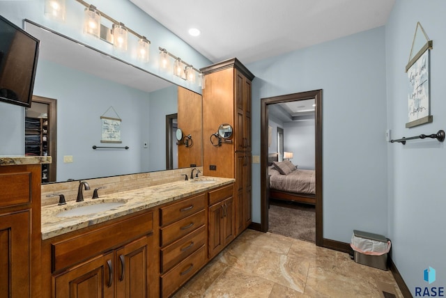 1301 S Hyannis Port Ln, Sioux Falls, SD 57106 - ensuite bathroom featuring double vanity and baseboards