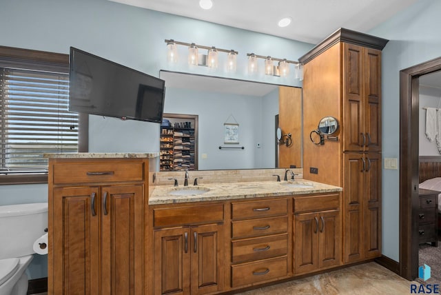 1301 S Hyannis Port Ln, Sioux Falls, SD 57106 - bathroom featuring toilet and double vanity