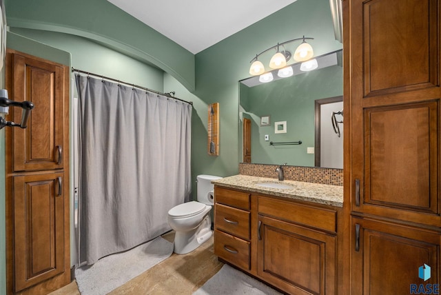 1301 S Hyannis Port Ln, Sioux Falls, SD 57106 - full bath featuring vanity, toilet, a shower with shower curtain, and decorative backsplash
