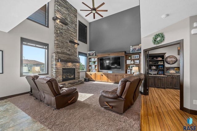1301 S Hyannis Port Ln, Sioux Falls, SD 57106 - living area featuring high vaulted ceiling, ceiling fan, baseboards, and a fireplace