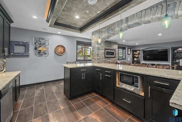 1301 S Hyannis Port Ln, Sioux Falls, SD 57106 - kitchen featuring built in microwave, stainless steel dishwasher, open floor plan, a raised ceiling, and dark cabinets
