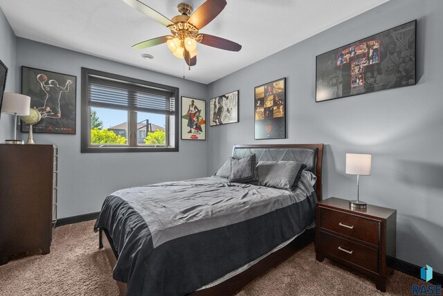 1301 S Hyannis Port Ln, Sioux Falls, SD 57106 - carpeted bedroom with baseboards and a ceiling fan