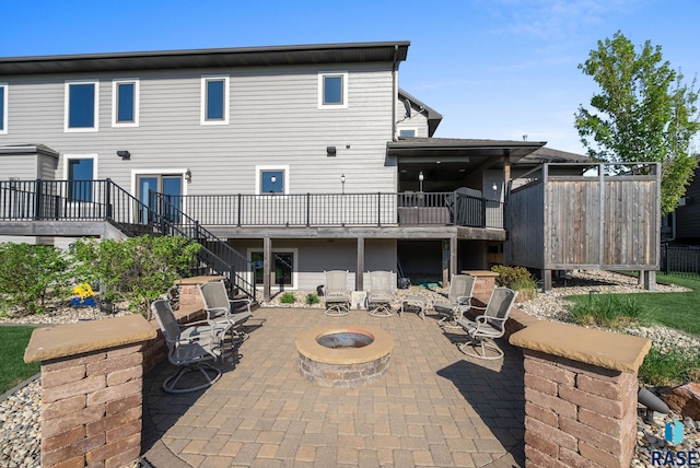 1301 S Hyannis Port Ln, Sioux Falls, SD 57106 - back of property featuring stairs, an outdoor fire pit, and a patio