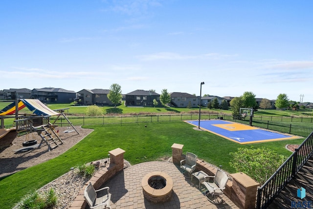 1301 S Hyannis Port Ln, Sioux Falls, SD 57106 - view of yard with an outdoor fire pit, community basketball court, a residential view, and a patio
