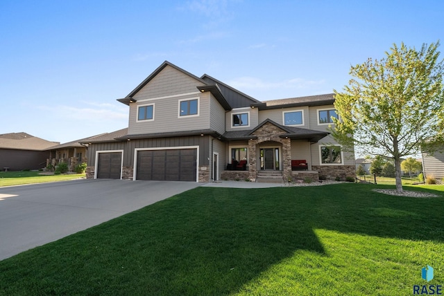 1301 S Hyannis Port Ln, Sioux Falls, SD 57106 - view of front of property with board and batten siding, stone siding, driveway, and a front yard