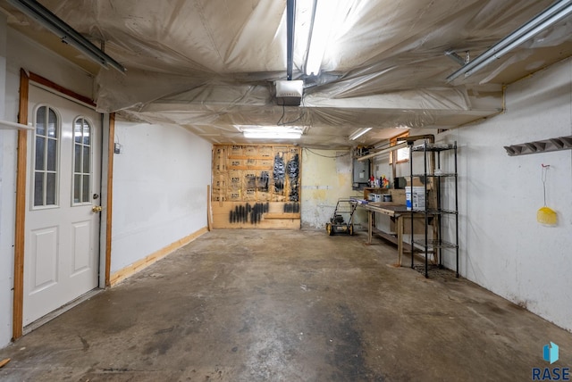 1300 S Point Dr, Sioux Falls, SD 57103 - basement featuring a workshop area, a garage, and electric panel
