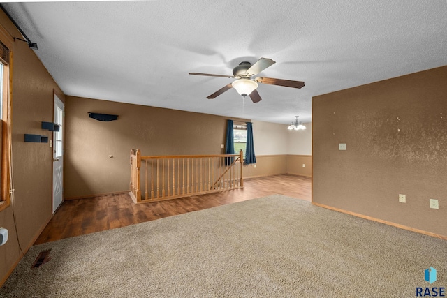 1300 S Point Dr, Sioux Falls, SD 57103 - carpeted empty room featuring a ceiling fan, a chandelier, and baseboards