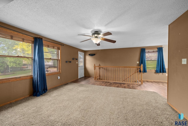 1300 S Point Dr, Sioux Falls, SD 57103 - unfurnished room with a ceiling fan, carpet, a textured ceiling, and baseboards