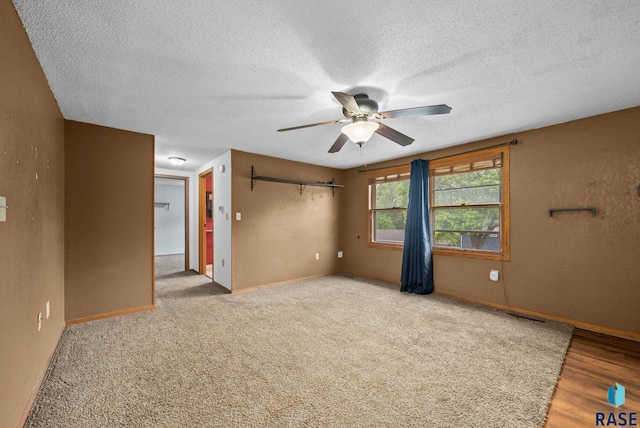 1300 S Point Dr, Sioux Falls, SD 57103 - spare room featuring a ceiling fan, a textured ceiling, and baseboards