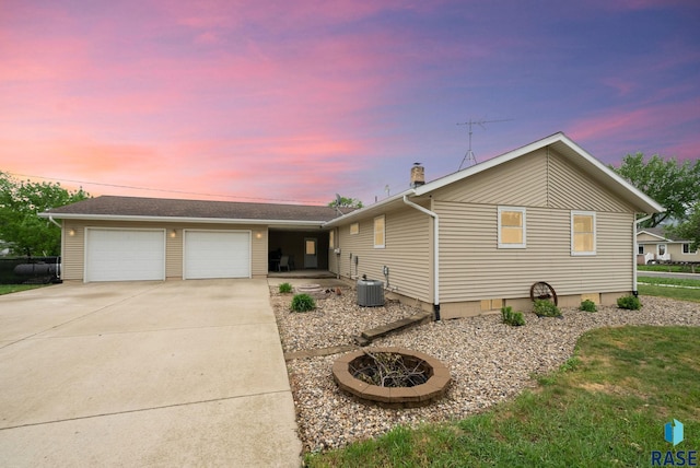 350 W Maple St, Edgerton, MN 56128 - ranch-style house with a garage, driveway, a chimney, and cooling unit