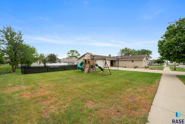 350 W Maple St, Edgerton, MN 56128 - view of yard featuring a playground, driveway, and an attached garage