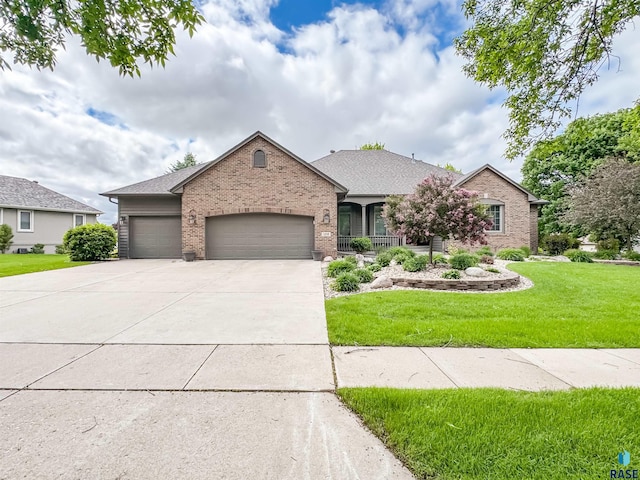 108 W Hazeltine Ln, Sioux Falls, SD 57108 - single story home featuring brick siding, an attached garage, a front lawn, and driveway