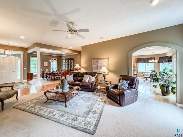 108 W Hazeltine Ln, Sioux Falls, SD 57108 - carpeted living area with a chandelier, arched walkways, recessed lighting, ceiling fan, and baseboards