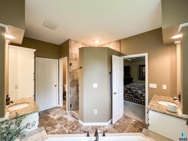108 W Hazeltine Ln, Sioux Falls, SD 57108 - ensuite bathroom featuring two vanities and a shower stall