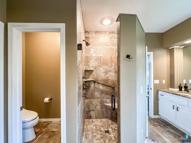 108 W Hazeltine Ln, Sioux Falls, SD 57108 - bathroom featuring a stall shower, vanity, toilet, and baseboards
