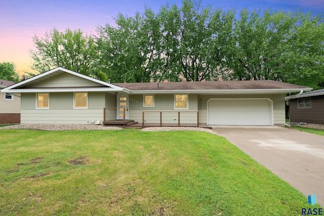 1912 E Sylvan Cir, Brandon, SD 57005 - ranch-style house with a garage, driveway, and a front lawn
